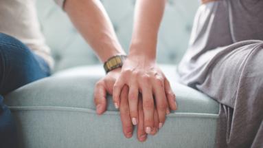 Female and a male touching hands